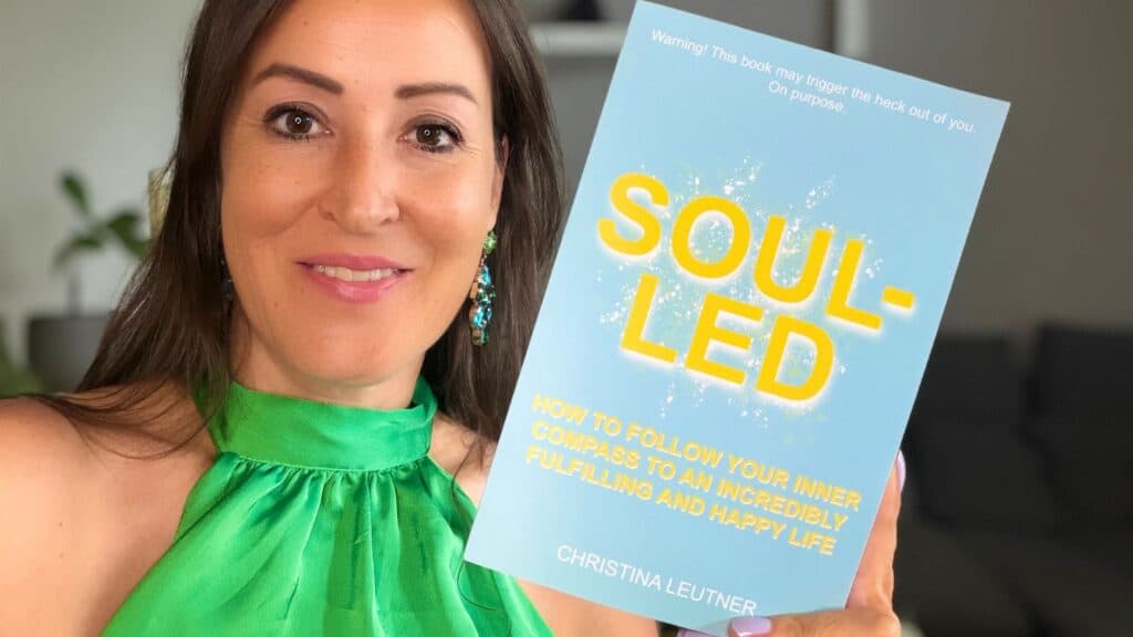 Author Christina Leutner with her book Soul-Led: How to Follow Your Inner Compass to an Incredibly Happy and Fulfilling Life
